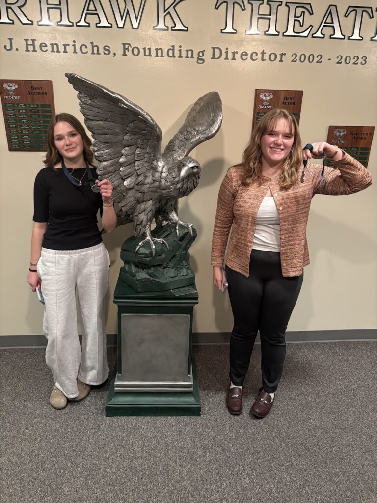 LSE Debaters with their awards in the LSW theater lobby